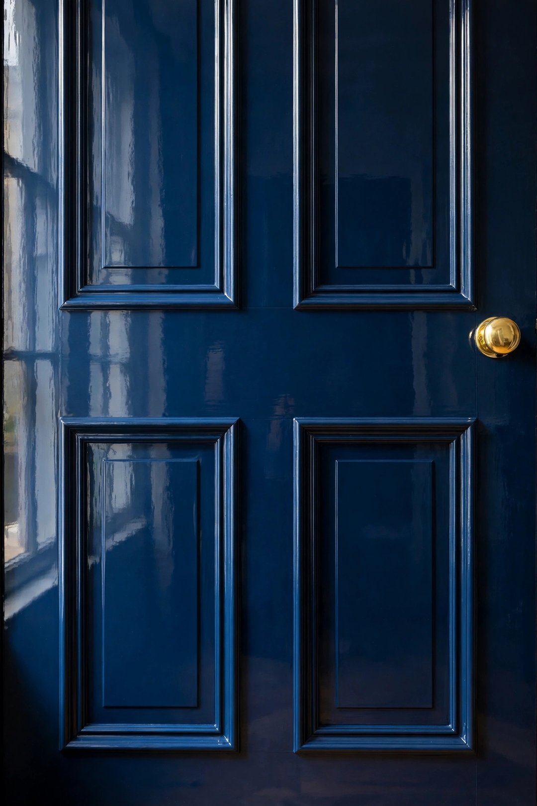 The same door finished in Hague Blue full gloss — every repair invisible